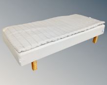 An IKEA Sultan 3' bed with topper.