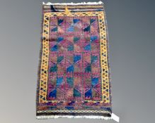 A Balouch rug, Afghanistan, 105cm by 62cm.