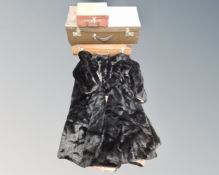 Three vintage luggage cases together with a faux fur coat.