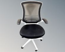An office armchair upholstered in a black mesh fabric (white)