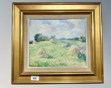Continental School : Hay stacks in a field, oil on canvas, indistinctly signed, 28cm by 24cm.