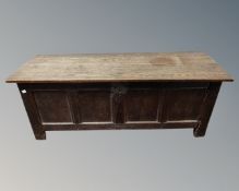 A George III panelled oak coffer.