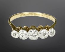 An 18ct yellow gold platinum set five stone diamond ring, size N, 2.2g.