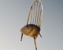 An Ercol elm and beech high backed dining chair in an antique finish
