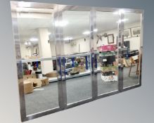 Four floor standing hair dresser's mirrors with backing boards.