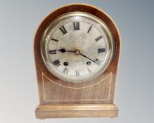 An Edwardian mahogany satinwood inlaid 8 day mantel clock with silvered dial
