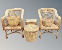 A group of wicker furniture to include pair of armchairs and four baskets