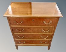 A continental beech four drawer chest containing craft supplies,