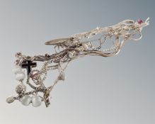 A collection of assorted silver and white metal necklaces.