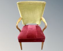 A Scandinavian beech framed armchair in draylon upholstery