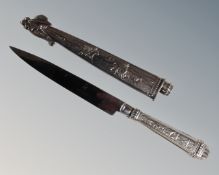 An ornate boot knife in metal scabbard, blade stamped Elmo Inox.