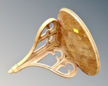 A Gothic oak corner wall bracket.