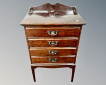 An Edwardian four drawer music chest.