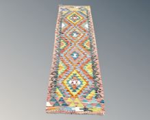 A Chobi Kilim runner, 200cm by 61cm.