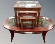 An oval two tier glass inset coffee table,