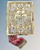 A Greek New Testament, attractively bound in gilt and silvered-metal, written in Cyrillic,