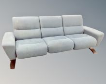 A Stressless three piece lounge suite : three seater settee (length 216 cm) and pair of armchairs,