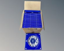 A box containing a collection of boxed Ringtons blue and white plates.