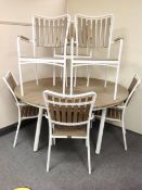 A circular patio table on painted metal base,