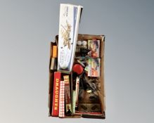 A box containing 20th century games and models, balsa wood model Spitfire Mk.