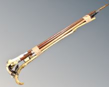 A bundle of six assorted walking canes including one with deer hoof handle.