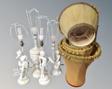 Four plaster classical style table lamps with shades.