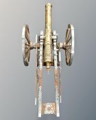 A large model of a field cannon, with brass barrel, mounted on carriage.