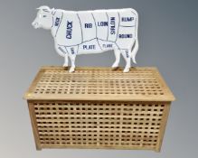 An enamelled butchers sign together with a latticework blanket box.