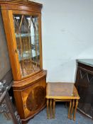 A yew wood standing corner cabinet together with a similar nest of three tables.