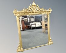 A Victorian gilt and gesso overmantel mirror.