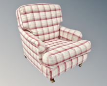 A Victorian style armchair in checkered fabric.