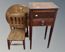An oak folding table together with a child's chair and a sewing table.