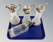 Three claret jugs with silver plated fittings and a vintage soda syphon.