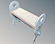 A painted piano stool.