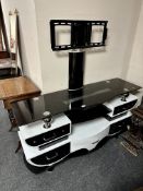 A contemporary glass TV stand/sideboard.