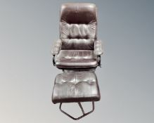A Scandinavian brown leather and metal framed armchair with matching footstool