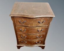 A mahogany serpentine front four drawer chest.