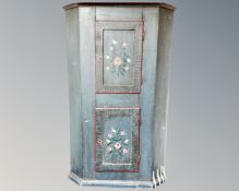 A 19th century continental painted pine corner cabinet, fitted with two cupboards.