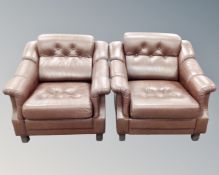 A pair of brown button leather Scandinavian armchairs
