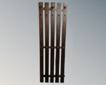 A stained pine coat rack,