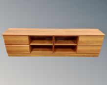 A teak effect low entertainment unit,