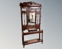 A Victorian heavily carved oak hall stand.