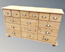 A pine and MDF fifteen drawer chest,