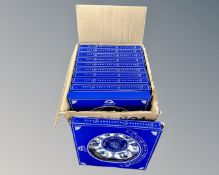 A box containing a collection of boxed Ringtons blue and white plates.