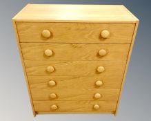 A pine effect six drawer chest,