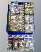 A tray containing Corinthian miniature footballer figurines.