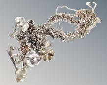 A collection of twelve assorted silver and white metal necklaces, most with pendants and named.