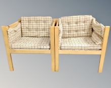 A pair of Scandinavian oak framed armchairs in checkered fabric