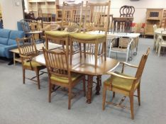 A reproduction dining table and six spindle back chairs