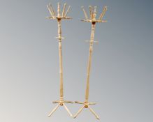 A pair of beech hat and coat stands.